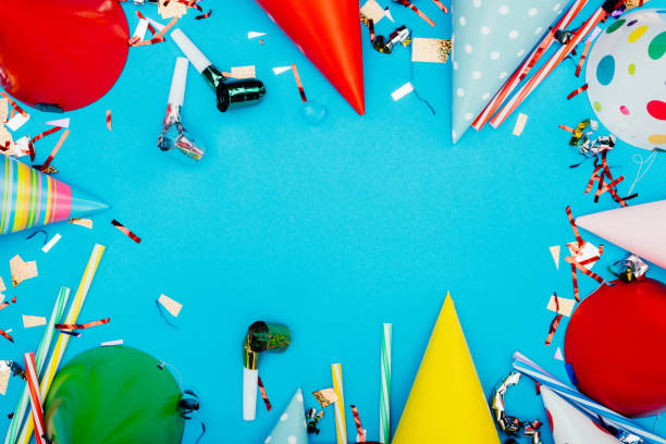 istock frame made of confetti and party hats 874976908