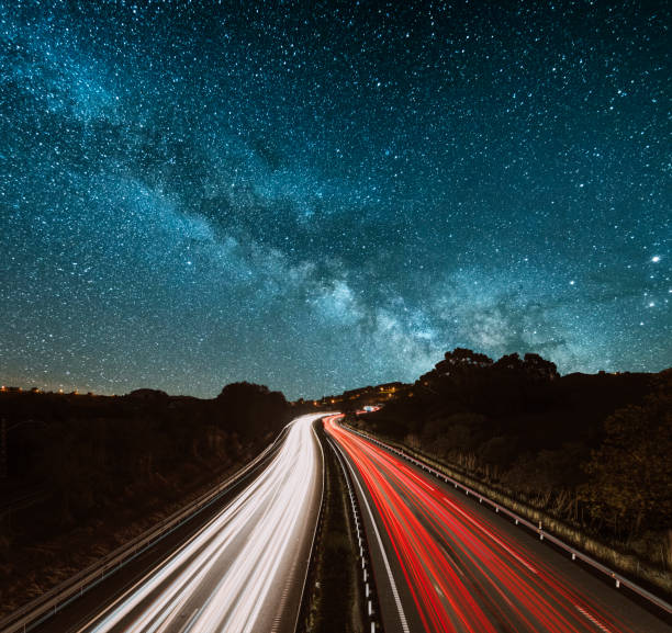 Highway at night Highway at night under the milky way car street blue night stock pictures, royalty-free photos & images