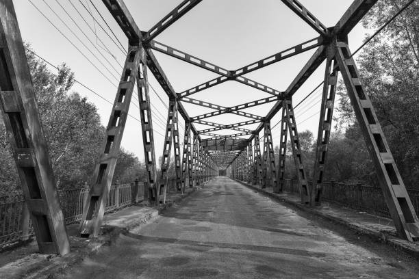 istock Old bridge over Tisa river in Vylok, Ukraine. 874983436