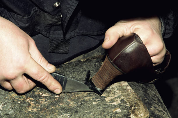 istock Shoemaker is repairing leather shoe. 874987436