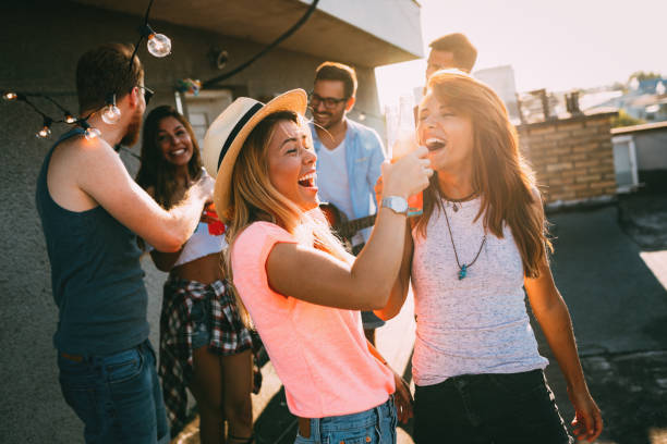 istock Happy young girls having fun at party 874988242