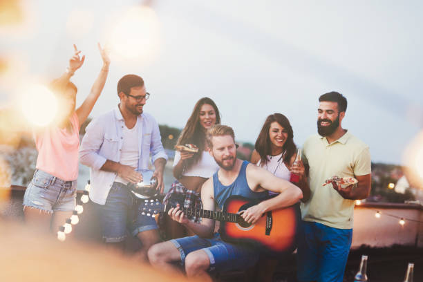 istock Friends having barbecue party on the roof 874991768