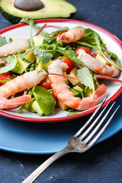 istock Salad with shrimp,tomatoes and arugula 874994360