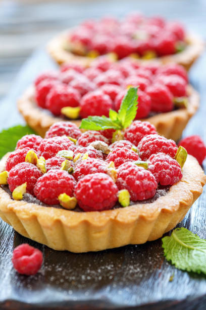istock Baskets of pastry with chocolate and raspberries. 874994516