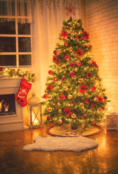 istock Christmas Tree Near Fireplace at Home 874997670