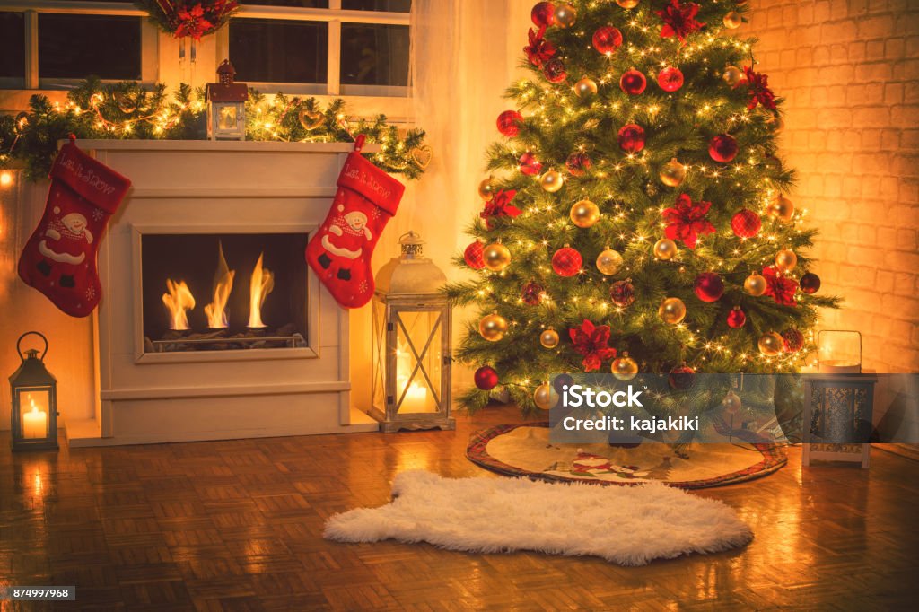 Christmas Tree Near Fireplace at Home Christmas tree near fireplace in decorated living room Christmas Stock Photo