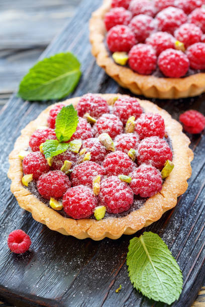 istock Delicious cakes with chocolate and fresh raspberries. 875000576