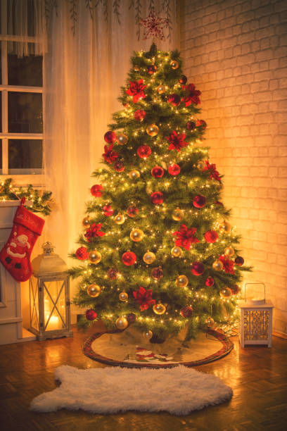 istock Christmas Tree Near Fireplace at Home 875000794