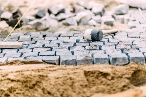 istock Pavement rocks, granite cobblestone blocks - details of path, road or sidewalk construction 875003932