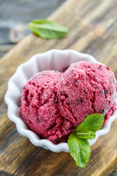 istock Berry ice cream of black currant and mint leaves. 875003998