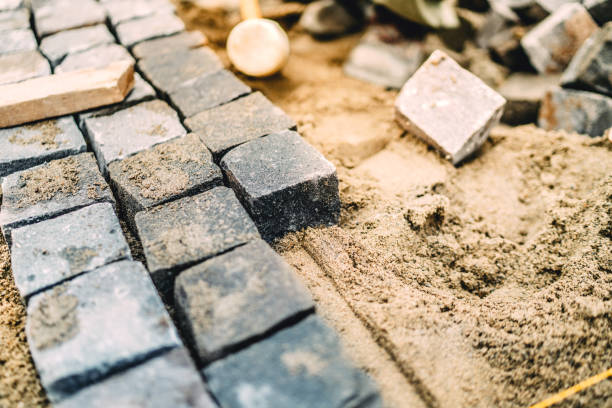 istock Close up details of roadworks. Stonework on footpath at construction site 875004014