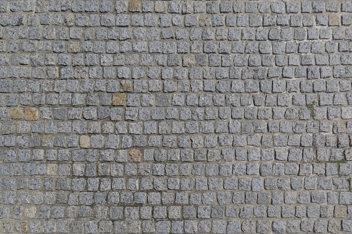 Full frame photo of a cobblestone road in daytime