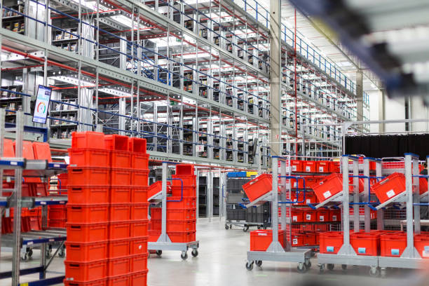 Large distribution warehouse Interior of large distribution warehouse with movement trolleys and shelves. filing tray stock pictures, royalty-free photos & images