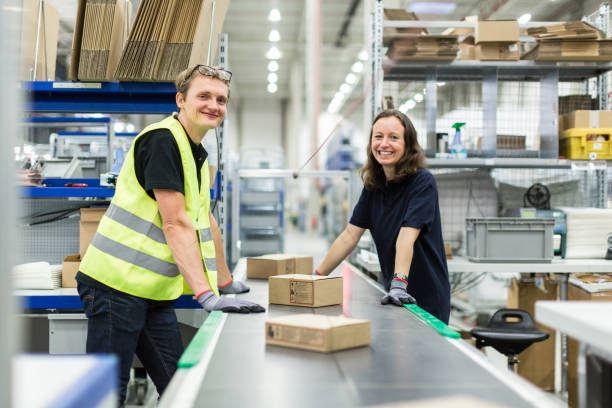 istock Young man and woman working in warehouse 875008168