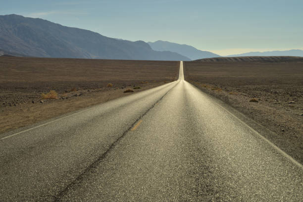 istock long empty desert road in Death Valley National Parl 875011014