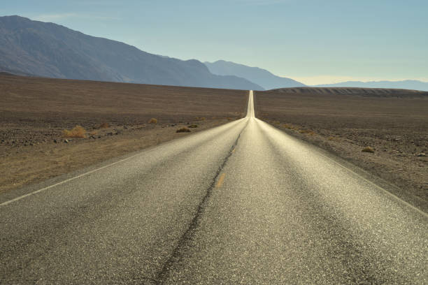istock long empty desert road in Death Valley National Parl 875011056