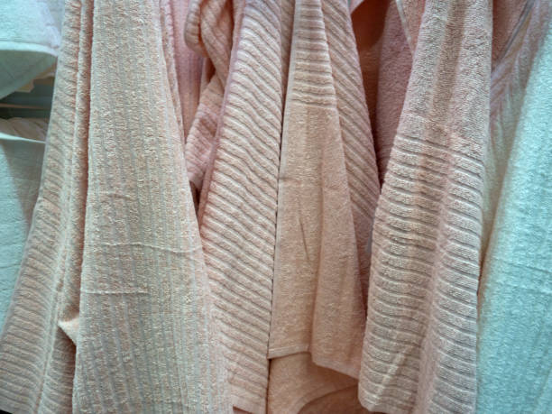 istock Multicolored towels hang on the hook in the bathroom 875021406