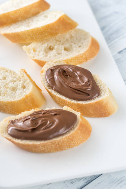 istock Slices of baguette with chocolate cream 875023948
