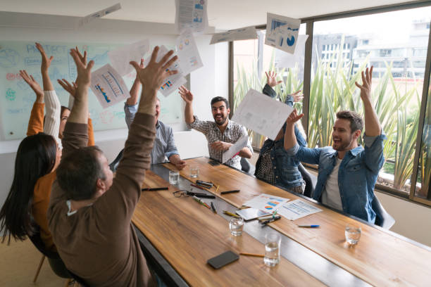 istock Successful designers celebrating a victory at a creative office 875024004