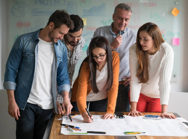 istock Group of architects in a meeting at a creative office 875024162