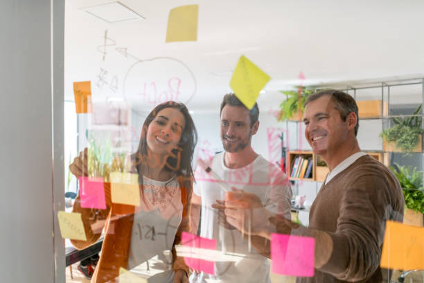 istock Group of designers brainstorming at a creative office 875024168