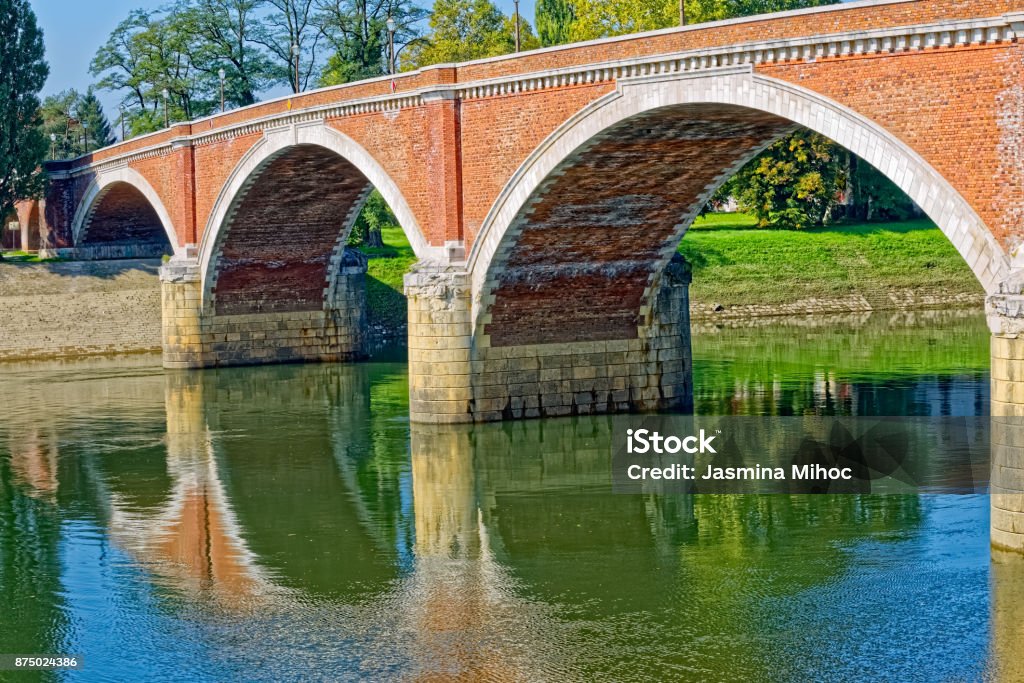 Sisak old bridge Old bridge on river Kupa on a beautiful sunny day in Sisak Croatia. Ancient Stock Photo
