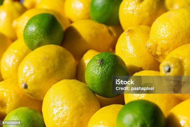 Fresh Lime Anf Lemons On Sale Stock Photo - Download Image Now - Lemon - Fruit, Lime, Backgrounds