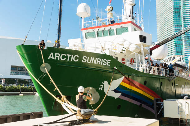 The Icebreaking Arctic Sunrise Leaving Miami The Arctic Sunrise, Greenpeace’s icebreaking research ship, leaving land after been docked in Downtown Miami for several days. This is the first ship to circumnavigate James Ross Island in the Antarctic, was built in 1975 and is Dutch flagged. greenpeace activists stock pictures, royalty-free photos & images