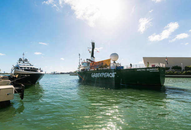 The Icebreaking Arctic Sunrise Leaving Miami The Arctic Sunrise, Greenpeace’s icebreaking research ship, leaving land after been docked in Downtown Miami for several days. This is the first ship to circumnavigate James Ross Island in the Antarctic, was built in 1975 and is Dutch flagged. greenpeace activists stock pictures, royalty-free photos & images