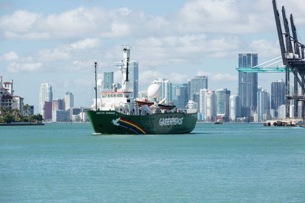 The Icebreaking Arctic Sunrise Leaving Miami The Arctic Sunrise, Greenpeace’s icebreaking research ship, leaving land after been docked in Downtown Miami for several days. This is the first ship to circumnavigate James Ross Island in the Antarctic, was built in 1975 and is Dutch flagged. greenpeace activists stock pictures, royalty-free photos & images