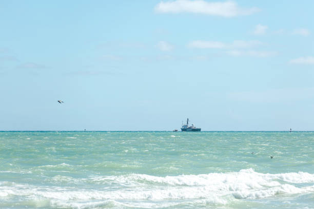 The Icebreaking Arctic Sunrise Leaving Miami The Arctic Sunrise, Greenpeace’s icebreaking research ship, leaving land after been docked in Downtown Miami for several days. This is the first ship to circumnavigate James Ross Island in the Antarctic, was built in 1975 and is Dutch flagged. greenpeace activists stock pictures, royalty-free photos & images