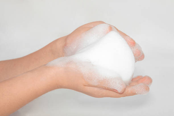 istock foam on hand isolated on white background 875031720