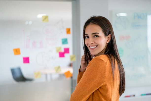 istock Happy woman brainstorming at a creative office 875031806