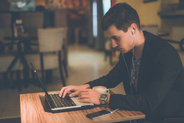 istock Listening music and using smart phone and laptop 875036224