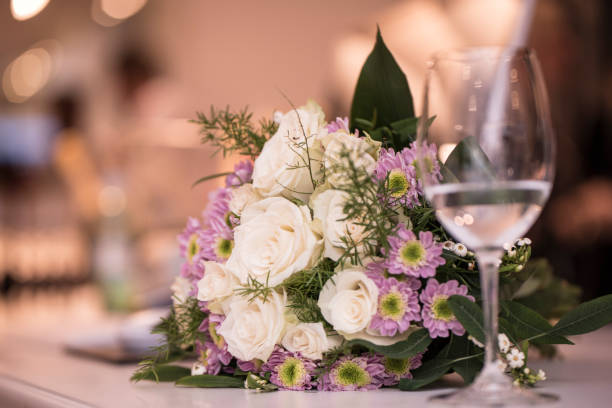 istock Bouquet and a drinking glass 875042772