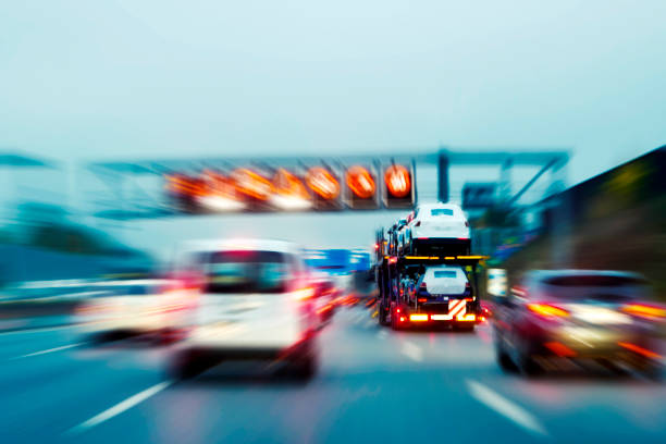 Lorry with new cars driving on motorway stock photo