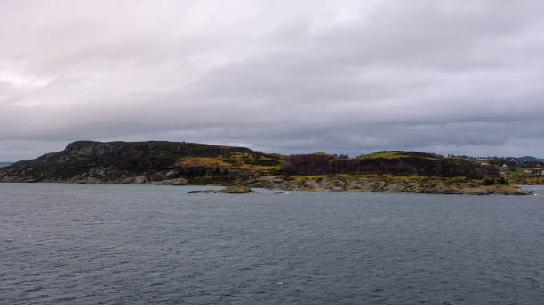 istock Cargo ship in Norwegian fjord 875049532