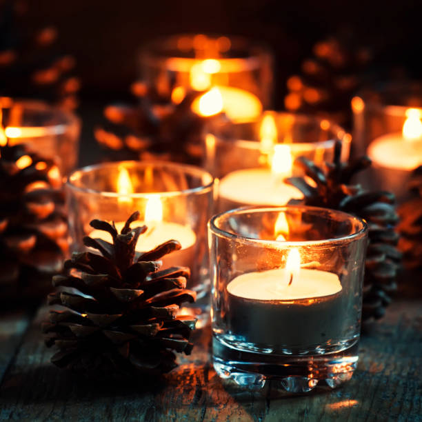 istock Christmas or New Year composition with burning candles in small glass candlesticks 875052824