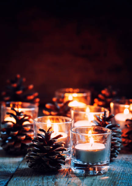 istock Christmas or New Year composition with burning candles in small glass candlesticks 875053020