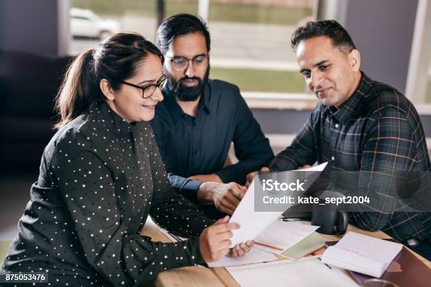 Couple And Financial Advisor Stock Photo - Download Image Now - Document, Assistance, Finance