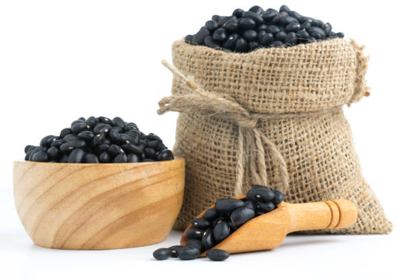 istock black beans in canvas sack on white background 875057342