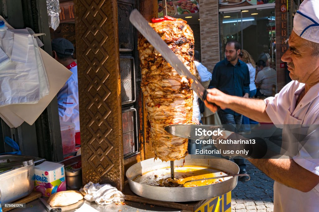 Turkish kebab chef, cook on Grand Bazaar Istanbul, Turkey - August 27, 2013: Turkish kebab chef, cook on Grand Bazaar. Traditional Turkish, arab street food vendor Doner Kebab Stock Photo