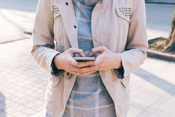 istock Mobile phone in female hands 875061686