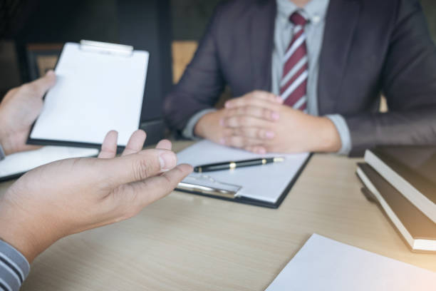 istock Job interview, Young attractive executives man asking questions to applicant about work history, colloquy dream,  Skill, expertise, experience and businessman listen to candidate answers 875061814