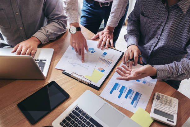 istock Business team meeting working with new startup project, discussion and analysis data the charts and graphs. Digital tablet, calculator, laptop computer using, Business finance and accounting concept 875061840