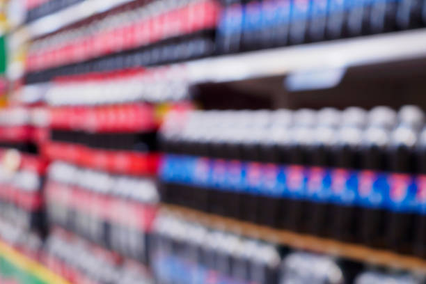 istock blur soft drinks bottles on shelves in supermarket 875064170