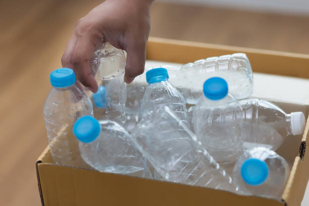 istock man hand putting plastic reuse  for recycling concept environmental protection world recycle 875064808