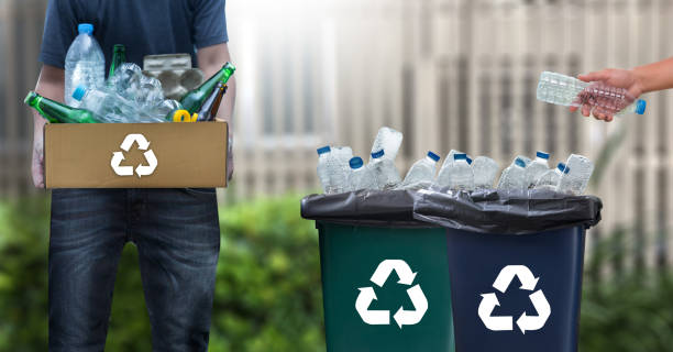 istock man hand putting plastic reuse  for recycling concept environmental protection world recycle 875064816