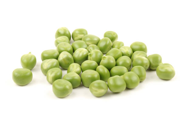 istock Fresh young green peas on the white background 875067436