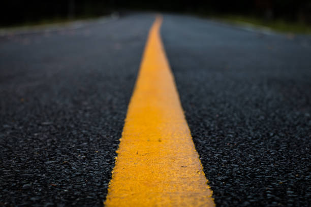 Close up line yellow asphalt road texture background.